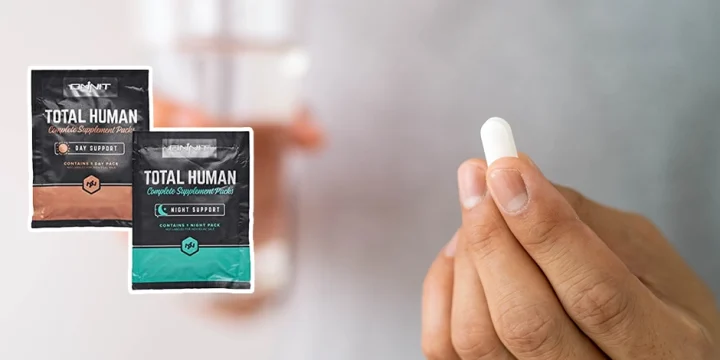 A close up shot of a person holding an ONNIT Total Human supplement