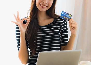 Woman ordering online through her laptop