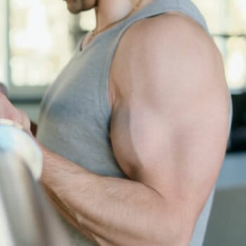 man flexing his arms