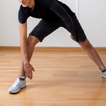 A man doing stretching exercises at home