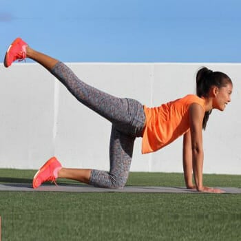 woman doing donkey kicks