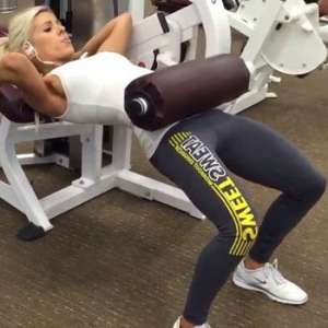 Woman Doing Hip Thrusts in a Bench