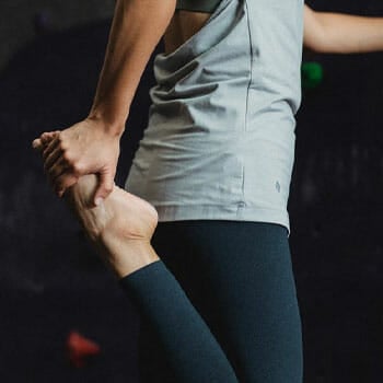 woman in a quad stretch position