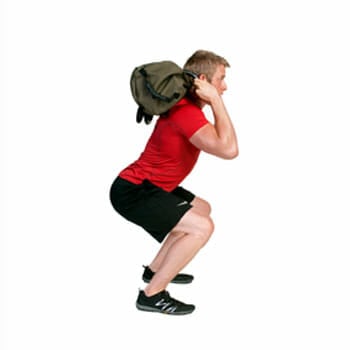 using sandbag to squat