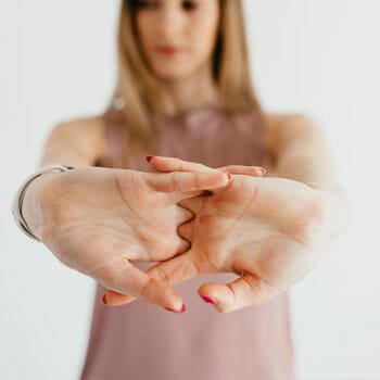 woman stretching wrists