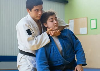 man and woman doing judo