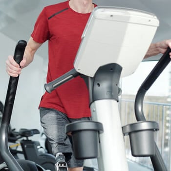 Man using an elliptical machine