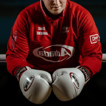 man in a red shirt with boxing gloves