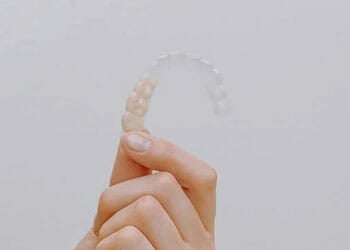 person holding a mouthguard