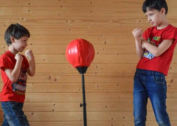 children playing with a heavy bag