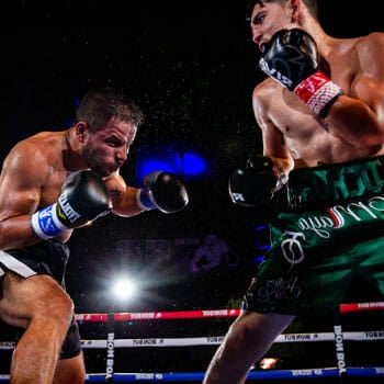 professional boxers fighting in the boxing ring