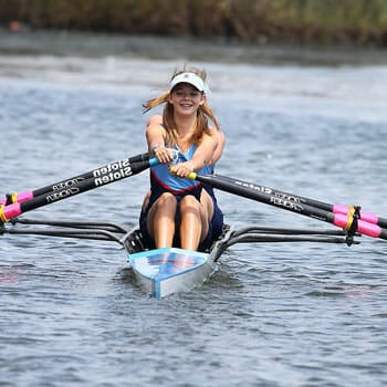 Woman rowing in a river