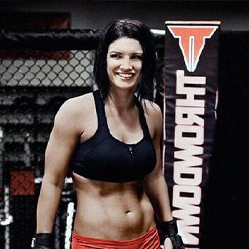 Professional UFC fighter smiling inside the ring