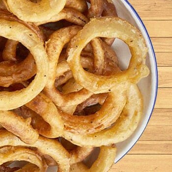 Vegan Onion Rings on a wooden surface