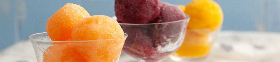 Three different flavors of Sorbet inside a glass bowl
