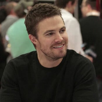 portrait image of Stephen Amell in a black shirt