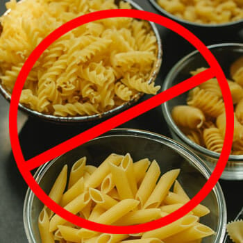 uncooked pasta in a bowl with an anti sign