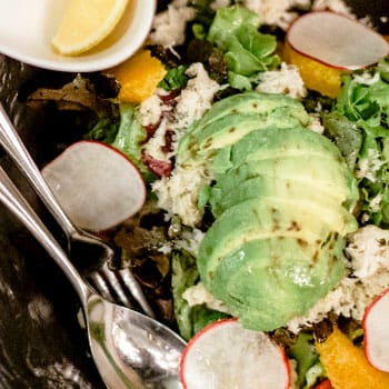 bowl filled of avocado salad and greens