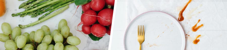 tomatoes, grapes and beans on top of the table, white plate with red sauce stain and a fork