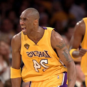 kobe bryant running in a basketball court