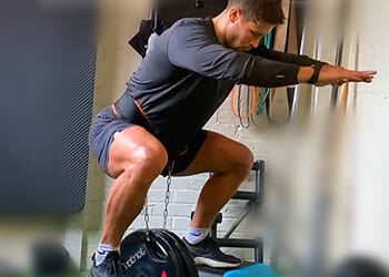 A man doing belt squats