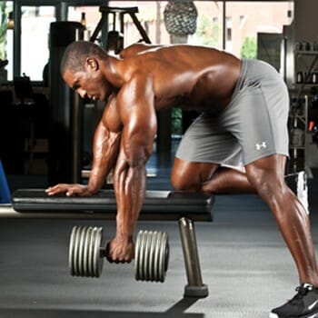 man in a single arm dumbbell row position