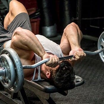 man in a skull crusher position