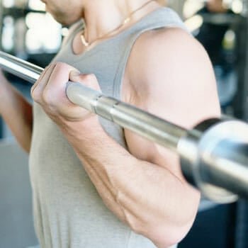 man working out using a barbell
