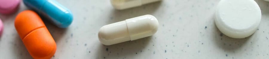 close up image of different types of supplement pills