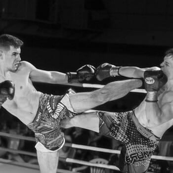 men athletes during their kickboxing match