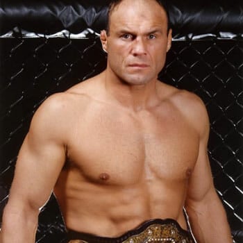 Randy Couture posing with his championship belt