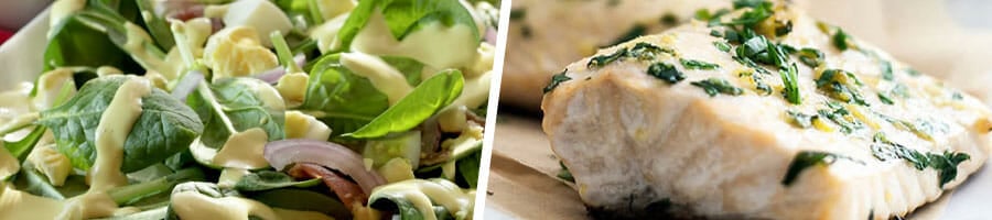 plate filled with green salad, close up image of a cooked chicken