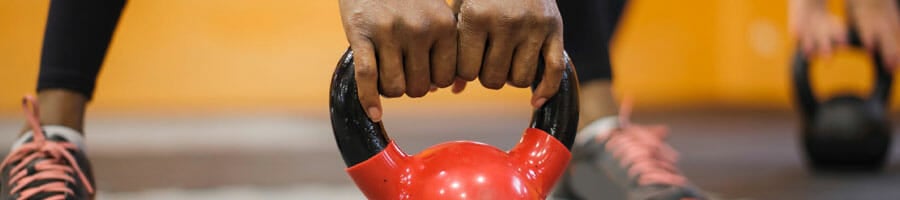 person working out using a kettlebell