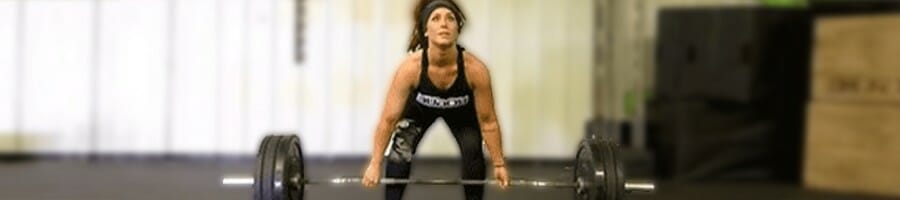 Chelsea about to lift a barbell