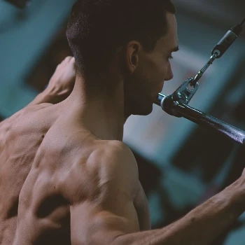 A muscular man doing his back workout