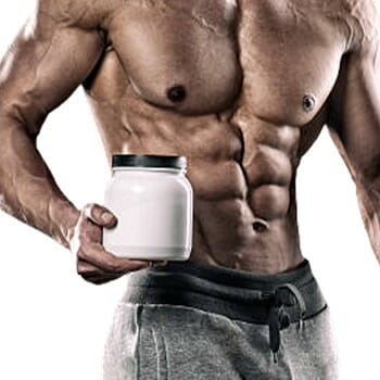 A guy holding a creatine supplement container