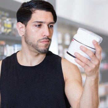 A guy looking at creatine's nutrition facts