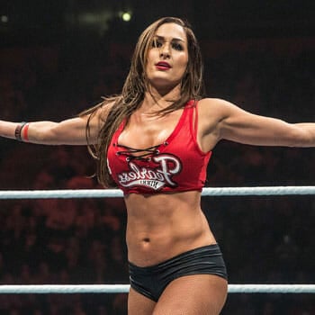 Nikki Bella in a two piece costume inside the WWE wresting ring