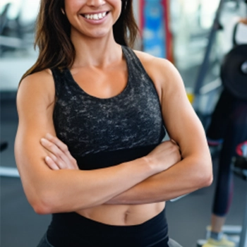 A fit woman standing in the gym