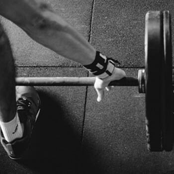 Monochromatic image of someone holding a barbell