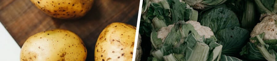 fresh potatoes on a tray, stack of kale