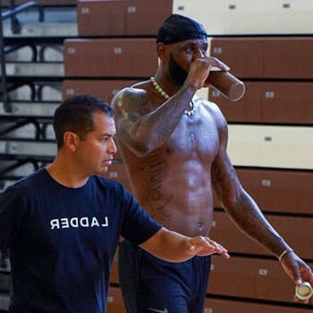 man with lebron james in a gym