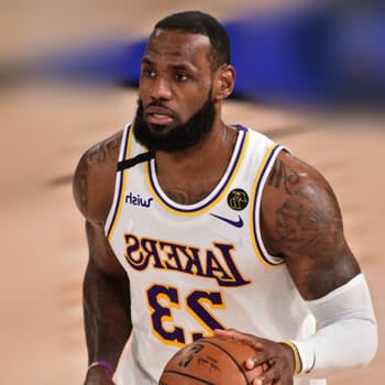 lebron james holding a basket ball during a game