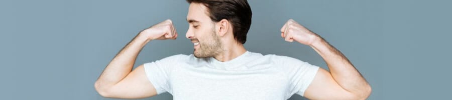 white man in a white shirt showing off his biceps