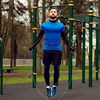 man using a jump rope outdoors