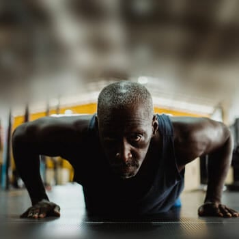 black man in a push up position