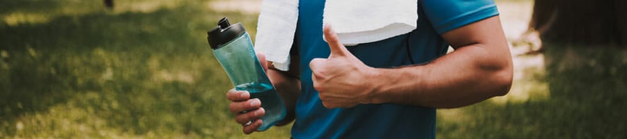 man giving a thumbs up while holding a water jug on the other