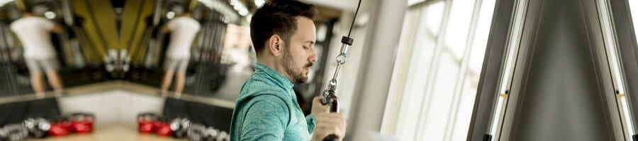 man working out his lats at the gym