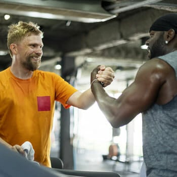 men giving each other a handshake after workout
