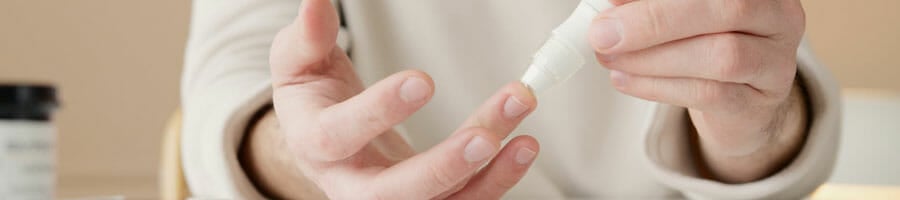 hand view of a man checking his sugar level